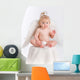 Adorable baby with angel wings on white Wall Decal