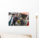 Paramedics and doctor unloading patient from ambulance Wall Mural