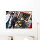 Paramedics and doctor unloading patient from ambulance Wall Mural