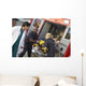 Paramedics and doctor unloading patient from ambulance Wall Mural