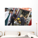 Paramedics and doctor unloading patient from ambulance Wall Mural