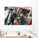 Paramedics and doctor unloading patient from ambulance Wall Mural