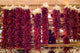 Chili peppers hanging on Santa Fe marketplace, New Mexico Wall Mural