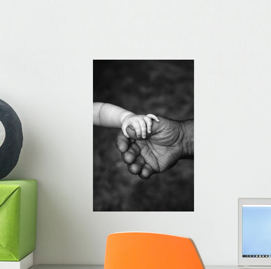 Baby's Hand Holding On To Adult Hand Wall Mural