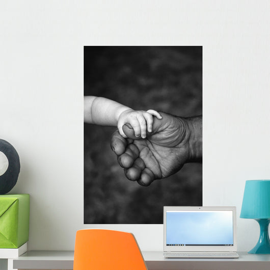 Baby's Hand Holding On To Adult Hand Wall Mural