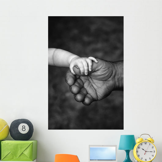 Baby's Hand Holding On To Adult Hand Wall Mural