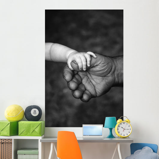 Baby's Hand Holding On To Adult Hand Wall Mural
