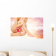Female legs with pink lily over heaven background Wall Mural