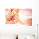 Female legs with pink lily over heaven background Wall Mural