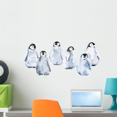 Six Baby Emperor Penguins Wall Decal Sticker Set shown on a wall