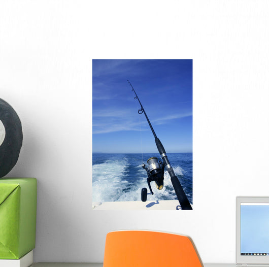 Fishing rod and reel on boat, fishing in blue ocean Wall Mural