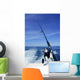 Fishing rod and reel on boat, fishing in blue ocean Wall Mural