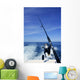 Fishing rod and reel on boat, fishing in blue ocean Wall Mural