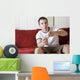 Gamer on the couch Wall Mural