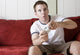 Gamer on the couch Wall Mural