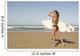 Young woman with surfboard on beach Wall Mural