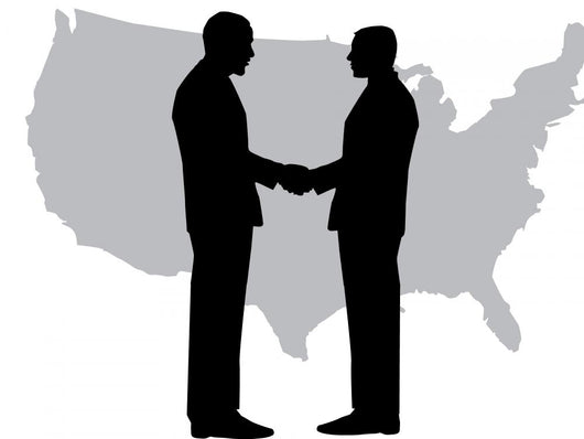 A silhouette of men handshaking with map of USA Wall Decal