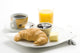 delicious continental breakfast of coffee and croissants Wall Mural