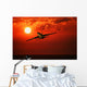 Airplane Flying In Sunrise/Sunset Wall Mural