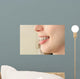 Girl smiles with braces Wall Mural