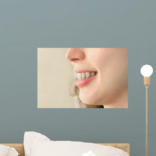Girl smiles with braces Wall Mural