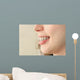 Girl smiles with braces Wall Mural