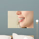 Girl smiles with braces Wall Mural