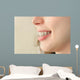 Girl smiles with braces Wall Mural