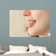 Girl smiles with braces Wall Mural