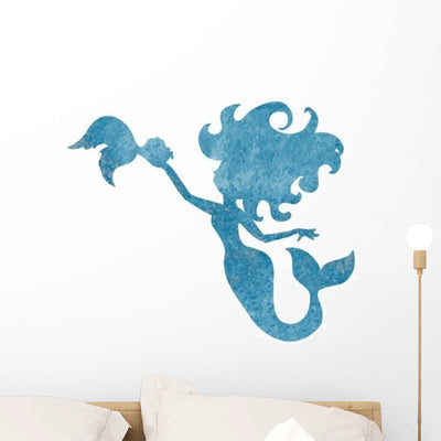 Blue Silhouette Watercolor Mermaid Wall Decal shown on a wall