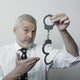 Senior Showing Pair Handcuffs Wall Decal