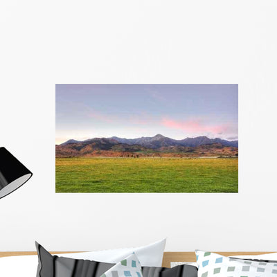 Sheep Grazing Sunrise Wall Decal shown on a wall