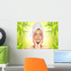 Beautiful young woman applying organic cosmetics to her skin Wall Mural