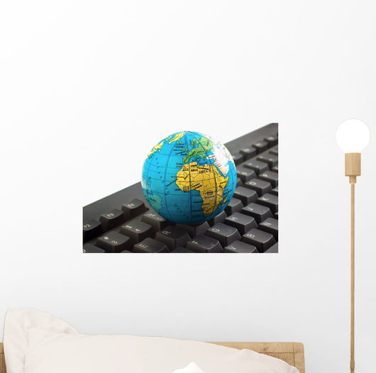 Africa on toy globe over keyboard Wall Decal