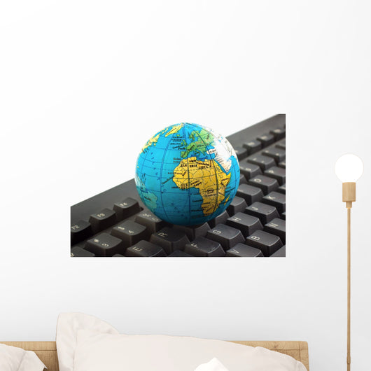 Africa on toy globe over keyboard Wall Decal