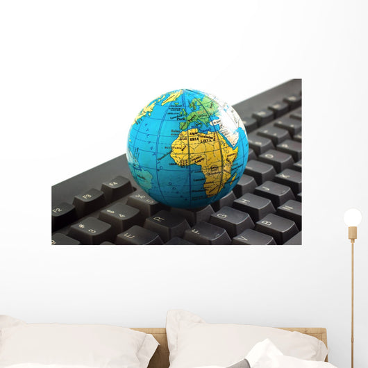 Africa on toy globe over keyboard Wall Decal