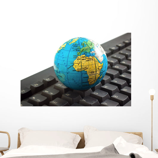 Africa on toy globe over keyboard Wall Decal