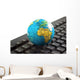 Africa on toy globe over keyboard Wall Decal