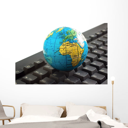 Africa on toy globe over keyboard Wall Decal