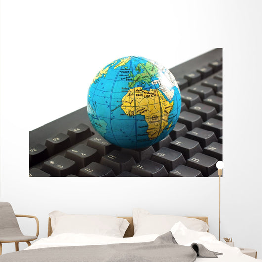 Africa on toy globe over keyboard Wall Decal