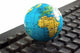 Africa on toy globe over keyboard Wall Decal