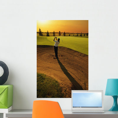 Golfer Taking Swing from Wall Mural shown on a wall
