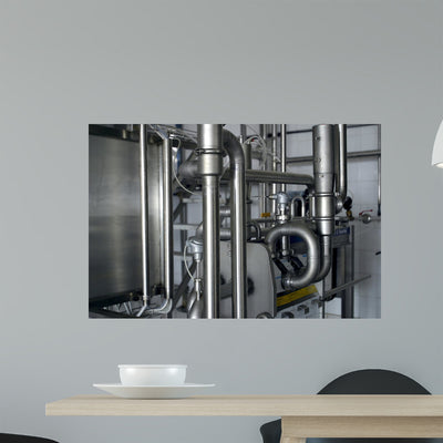 Industrial Stainless Steel Pipe Wall Mural shown on a wall