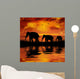 Elephants on a Beautiful Sunset Background Wall Mural
