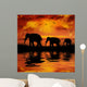 Elephants on a Beautiful Sunset Background Wall Mural