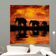 Elephants on a Beautiful Sunset Background Wall Mural