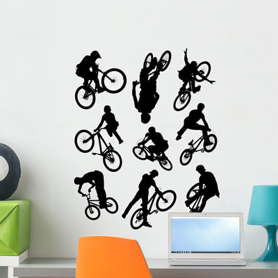 Bike Stunt Silhouettes Wall Decal Sticker Set shown on a wall