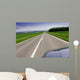 Fast moving car on road Wall Mural