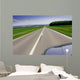Fast moving car on road Wall Mural