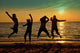Teens Jumping Beach Wall Mural